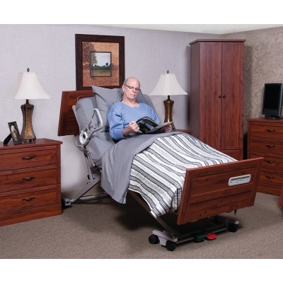 Man sitting in Basic American Zenith 9100 Hi Low Hospital Bed
