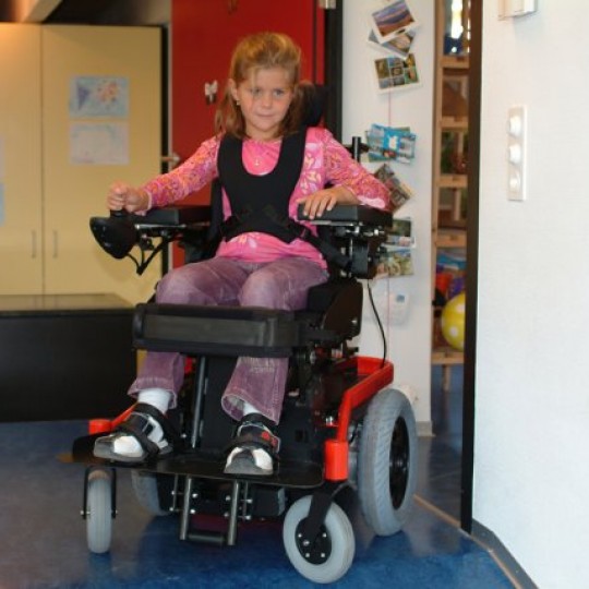 Child sitting in LEVO Combi Jr Standing Power Chair
